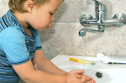 child washing hands