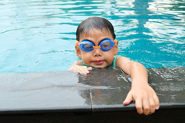 Young boy at the swimming pool