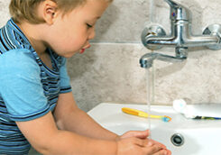 child washing hands